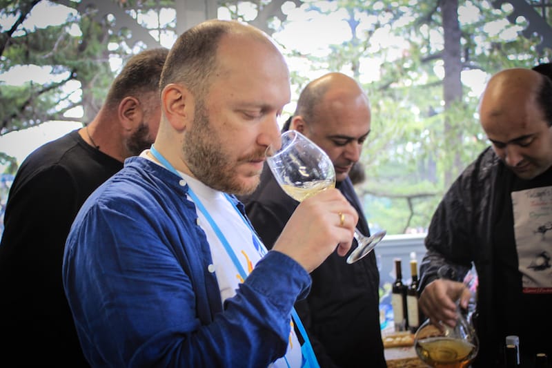 Malkhaz Kharbedia, President of the Georgian Wine Club, tasting wine, photo by Paul Rimple