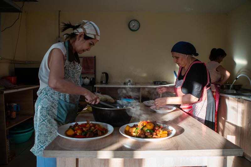 Dilbar Aisan (L) started the Xinjiang restaurant that she runs with two local Azerbaijani-Georgian ladies after a downturn in her stone tile importing business, photo by Pearly Jacob