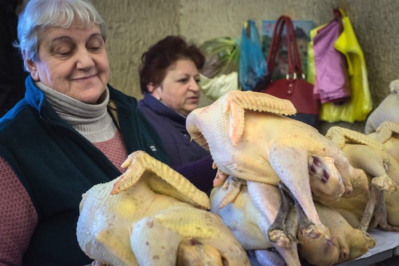 A vendor in the Deserter's Bazaar sells turkeys for Christmas feasts, photo by Paul Rimple