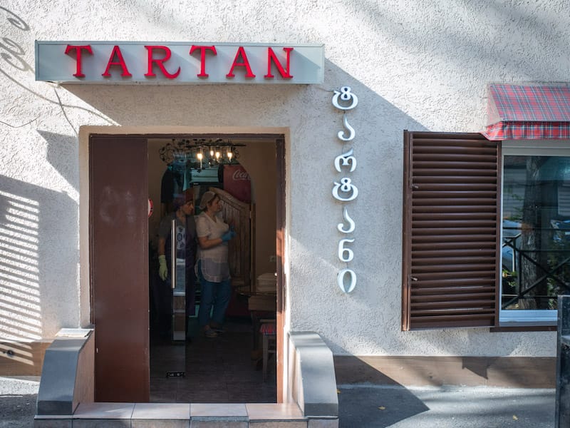 Tartan, a takeout cafeteria, is located in a step-down ground-floor apartment