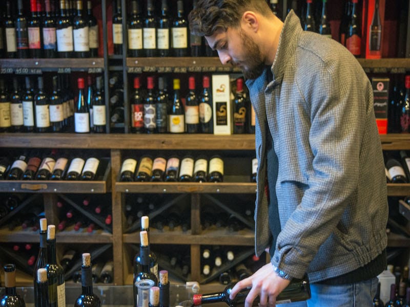 Pouring a taster at Vinotheca, photo by Paul Rimple