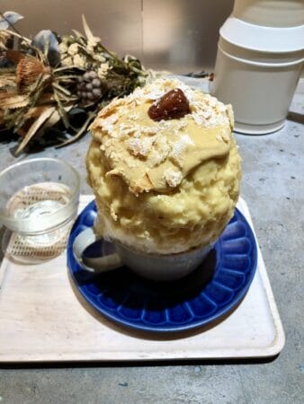 Chestnut kakigori served with a glass of warm water, photo by Florentyna Leow