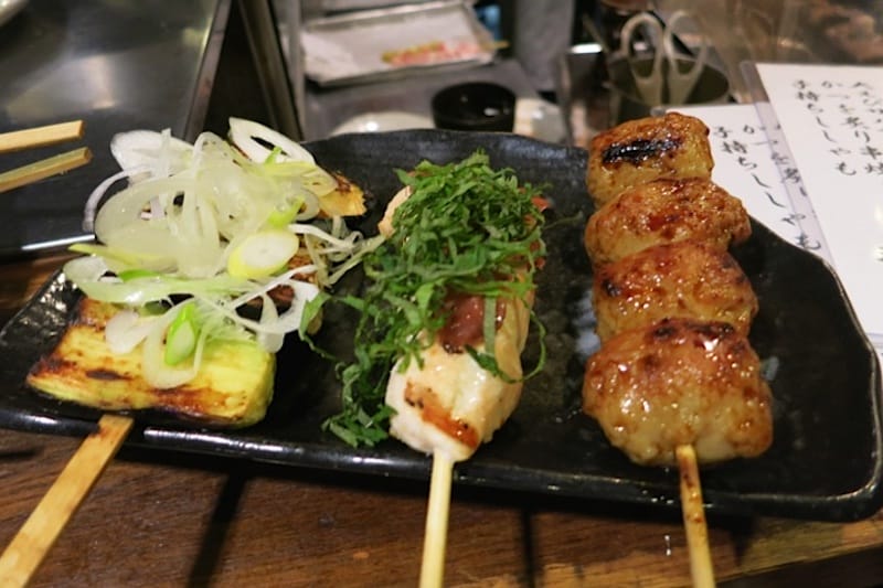 Kushiwakamaru's charcoal-grilled eggplant, white meat chicken with plum paste and shiso and chicken meatballs, photo by Fran Kuzui