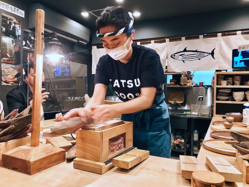 Owner Mai Nagamatsu shaving katsuobushi flakes behind the counter, photo by Florentyna Leow